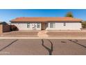 Single-story home with a desert-landscaped front yard and an inviting front porch at 39894 N Fazio Ln, San Tan Valley, AZ 85140