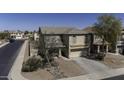 A clear view of the front exterior showcasing the front lawn and driveway at 40866 W Sanders Way, Maricopa, AZ 85138