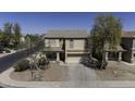 A daytime shot of the home highlighting the front exterior, landscaping, and facade at 40866 W Sanders Way, Maricopa, AZ 85138