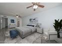 Cozy bedroom with neutral tones, decorative art, and a comfortable seating area at 6025 W Marconi Ave, Glendale, AZ 85306