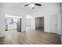 Open living space with updated kitchen and views into the bedrooms at 6201 W Acoma Dr, Glendale, AZ 85306