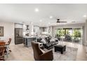 Open-concept living room with modern finishes, adjacent to an island kitchen at 7642 E Pasadena Ave, Scottsdale, AZ 85250