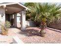 Inviting front porch with decorative columns and manicured landscaping at 8666 E Fillmore St, Scottsdale, AZ 85257