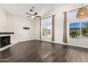 Spacious living room featuring hardwood floors, fireplace, and ample lighting at 984 W Hudson Way, Gilbert, AZ 85233