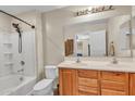 Clean bathroom features a shower-tub combo and double sink vanity with wooden cabinetry at 1265 S Aaron St # 285, Mesa, AZ 85209