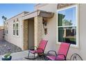 Relaxing front porch featuring comfortable seating and charming decor, perfect for enjoying the outdoors at 13409 N Emberwood Dr, Sun City, AZ 85351