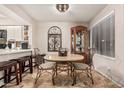 Cozy dining area featuring a stylish table set and a corner cabinet at 1718 S Longmore St # 116, Mesa, AZ 85202