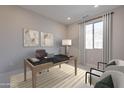 Well-lit home office with a modern desk setup, comfortable seating, and ample space for productivity at 2121 W Sonoran Desert Dr # 95, Phoenix, AZ 85085