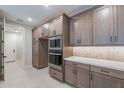 Modern kitchen design featuring stainless steel appliances, custom cabinets, and sleek countertops at 2121 W Sonoran Desert Dr # 95, Phoenix, AZ 85085