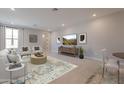 Bright living room features modern furnishings, neutral tones, and a large television for entertainment at 2121 W Sonoran Desert Dr # 95, Phoenix, AZ 85085