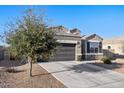 Charming single-Gathering home featuring desert landscaping and a two-car garage at 25634 W Samantha Way, Buckeye, AZ 85326