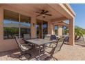 Relaxing covered patio with ample seating perfect for outdoor dining and entertaining at 26237 W Vista North Dr, Buckeye, AZ 85396