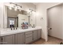 Bathroom features dual sinks with white tile countertops and ample cabinet space at 2718 E Bighorn Ave, Phoenix, AZ 85048