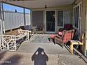 Relaxing covered patio with comfortable seating, perfect for enjoying the outdoors in any weather at 3160 E Main St # 62, Mesa, AZ 85213