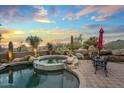 Relaxing pool and hot tub area amidst the Arizona desert, perfect for outdoor entertaining with desert scenery at 40545 N 109Th Pl, Scottsdale, AZ 85262