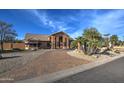 Beautiful single-story home with meticulous desert landscaping and a paved driveway leading to the entrance at 5332 W Misty Willow Ln, Glendale, AZ 85310