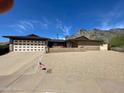 Charming home with a desert landscape and mountain views, featuring a spacious driveway and two-car garage at 6808 N 26Th St, Phoenix, AZ 85016