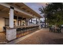 Stylish outdoor bar area with ample seating, perfect for entertaining with outdoor lounge at 11300 N Casa Dega Dr # 1044, Surprise, AZ 85388