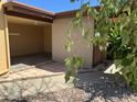Exterior shot of the property featuring a covered parking area and desert landscaping for low maintenance at 12639 N 113Th Dr, Youngtown, AZ 85363