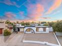 Charming single-story home featuring an eye-catching arched entryway and well-maintained landscaping at 1317 E Verlea Dr, Tempe, AZ 85282