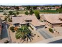 Aerial view showing the landscaped front yard and tile roof at 18514 N Laguna Azul Ct, Surprise, AZ 85374