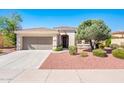 Charming single-story home featuring a two-car garage, desert landscaping, and a cozy front porch at 22236 N Arrellaga Dr, Sun City West, AZ 85375