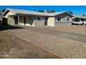 Inviting home with neutral tones, covered parking, and low-maintenance landscaping at 3338 W Palmaire Ave, Phoenix, AZ 85051