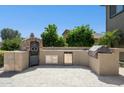 Outdoor kitchen featuring built-in appliances and ample counter space, ideal for entertaining at 44390 W Buckhorn Trl, Maricopa, AZ 85138