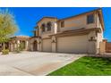 Beautiful two-story home featuring a three-car garage and a well-kept front yard at 4725 N 152Nd Dr, Goodyear, AZ 85395