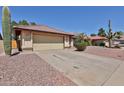 Well-kept single-story home featuring low maintenance landscaping, and a two-car garage at 5358 E Glencove St, Mesa, AZ 85205