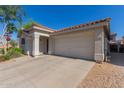 Welcoming single-story home with tile roof, desert landscaping, and an attached two-car garage at 640 E Browning Way, Chandler, AZ 85286