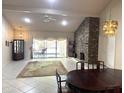 Open dining room with stone fireplace and sliding door access to an outdoor patio at 8552 E Vía Del Palacio --, Scottsdale, AZ 85258