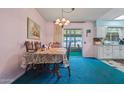Cozy dining area with traditional furniture and sliding glass doors to the patio at 11012 W Caron Dr, Sun City, AZ 85351