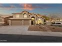 Inviting two-story home boasts desert landscaping, a three-car garage and mountain views at 14823 S 13Th Pl, Phoenix, AZ 85048