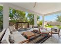 Inviting covered patio featuring comfortable seating and a serene water feature, perfect for outdoor relaxation at 17332 W Wildwood St, Surprise, AZ 85388