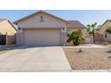 Inviting single-story home boasting a two-car garage and desert landscaping, offering curb appeal at 19279 W Jefferson St, Buckeye, AZ 85326