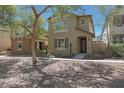 Charming two-story home featuring desert landscaping and a welcoming front porch at 20563 W White Rock Rd, Buckeye, AZ 85396