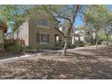 This charming two-story home features desert landscaping and a welcoming front porch at 20563 W White Rock Rd, Buckeye, AZ 85396