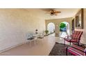 Relaxing covered patio with ceiling fan, furniture, and access to the community at 2277 N Recker Rd # 6, Mesa, AZ 85215