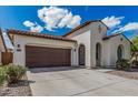 Inviting single-Gathering home featuring a two-car garage and low maintenance landscaping at 3943 E Ficus Way, Gilbert, AZ 85298