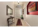 Inviting entryway with neutral tile flooring, decorative mirror, and attractive decor at 4251 N Morning Dove Cir, Mesa, AZ 85207