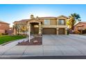 Stunning two-story home features a three-car garage and beautifully landscaped front yard at 4812 S Windstream Pl, Chandler, AZ 85249