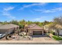 Gorgeous home featuring desert landscaping, a two-car garage, and a spacious driveway at 903 W Raven Dr, Chandler, AZ 85286