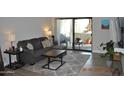 Relaxing living room with comfortable seating and sliding door access to a private patio at 10444 N 69Th St # 128, Paradise Valley, AZ 85253
