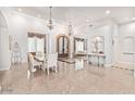 This home includes an elegant dining room that is open to the foyer and living room at 11054 E North Ln, Scottsdale, AZ 85259