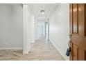 Inviting entryway with light gray walls and stylish wood-look tile flooring at 11910 E Amanda Rd, Gold Canyon, AZ 85118