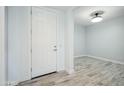Bright entryway featuring wood-look tile and fresh neutral paint at 11910 E Amanda Rd, Gold Canyon, AZ 85118