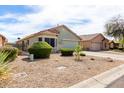 Lovely single-story home showcasing desert landscaping and a two-car garage at 1347 E Vernoa St, San Tan Valley, AZ 85140