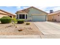 Beautiful single-story home with a well-maintained front yard and attached two-car garage at 1347 E Vernoa St, San Tan Valley, AZ 85140