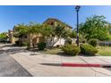 Beautiful home exterior with lush greenery, trees, and a well-kept lawn at 1367 S Country Club Dr # 1295, Mesa, AZ 85210
